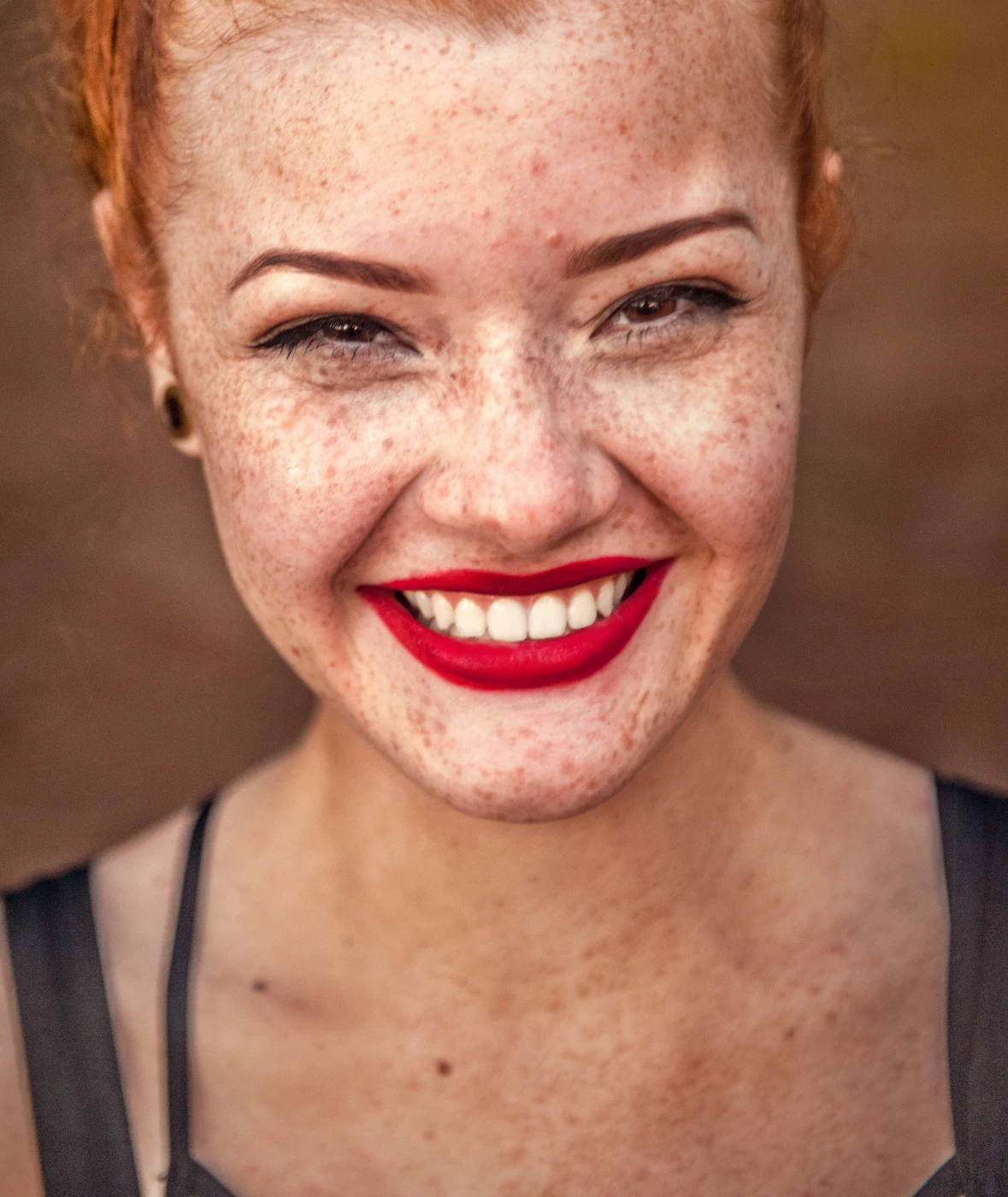 Freckles kept, skin evened, smile brightened (default settings) — before